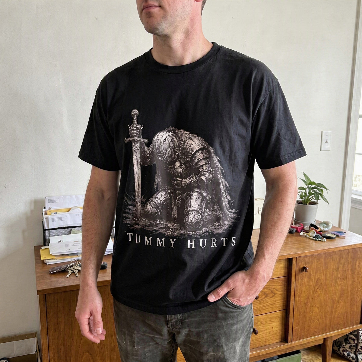 Tummy Hurts graphic tee shown in a lifestyle photograph