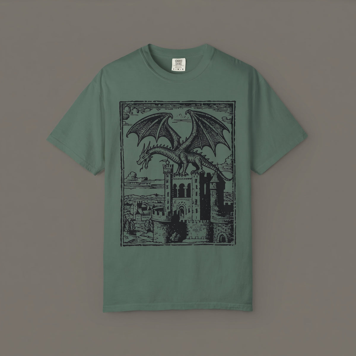 Blue spruce T-shirt featuring a dragon above a medieval stone castle